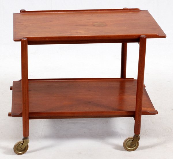 RAYMOR DANISH MODERN TEAKWOOD TEA CART: RAYMOR, DANISH MODERN TEAKWOOD TEA CART, H 25", W 29", D 20":A two tiered drinks cart, with removable upper and lower trays on castors. Measures approximately H.25" x 29 1/4" x 20 1/2". Raymor label o