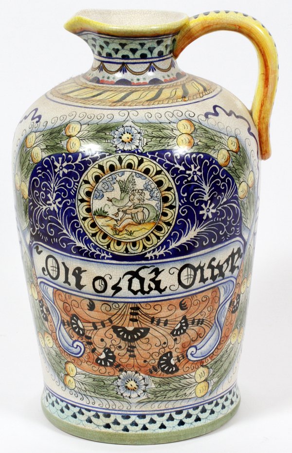 MAJOLICA POTTERY PITCHER: MAJOLICA POTTERY PITCHER, H 15":having leaf, floral and vine designs. Scene with child figure and bird. Central band with old European script in black.
