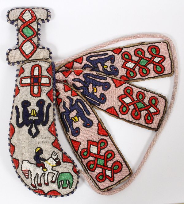 AFRICAN BEADED MACHETE AND SHEATH: AFRICAN BEADED MACHETE AND SHEATH H 20":An African machete having beaded hilt with a sheath encased in beads featuring designs of animals and a man riding a horse.