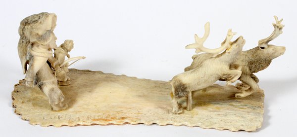 LUKIE AIRUT CARVED ANTLER FIGURE: LUKIE AIRUT CARVED ANTLER FIGURE, H 2.75", L 8", "CHASING CARIBOU":Likie Airut carved antler figure, 'Chasing Caribou'.