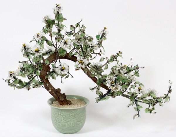 CHINESE CARVED QUARTZ & GLASS TREE: CHINESE CARVED QUARTZ & GLASS TREE, H 19", L 24":Potted tree form, decorated with white flowers and bumble bees. Measuring H. 19 1/2" x 24" overall. Celadon porcelain pot.