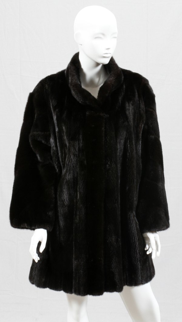 CERESNIE & OFFEN BIRMINGHAM MI MINK COAT: CERESNIE & OFFEN, BIRMINGHAM, MI, MINK THREE-QUARTER LENGTH COAT:Monogrammed at the interior, with four hook and eye closures. Measures L.25" from the shoulder seam to the hem; overall approximately H
