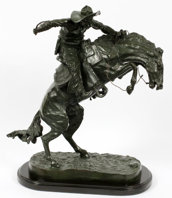 AFTER FREDERIC REMINGTON BRONZE SCULPTURE: AFTER FREDERIC REMINGTON (AMERICAN, 1861-1909), BRONZE SCULPTURE, H 23", 'BRONCO BUSTER':Signed; on a marble base. Measures H.23" x 19".