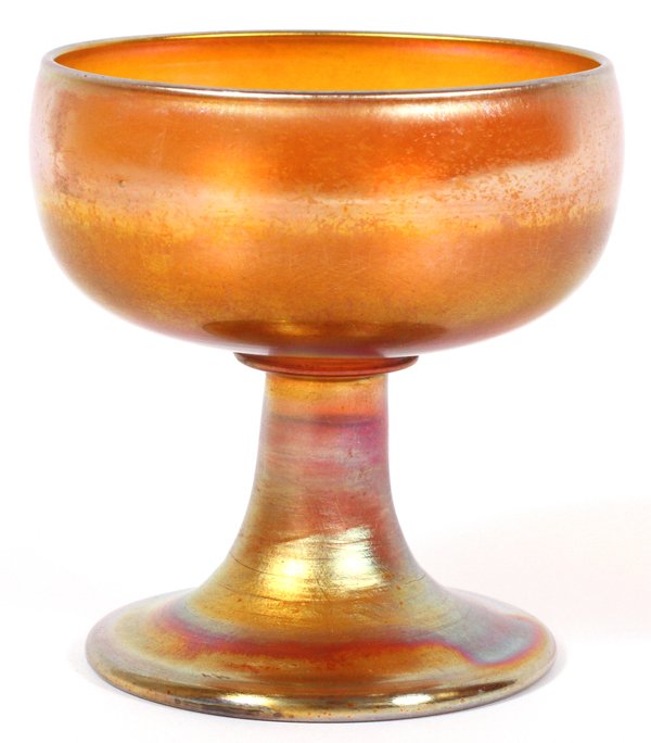 IRIDESCENT GLASS WINE/SHERBET: IRIDESCENT GLASS WINE/SHERBET, H 3 1/2":A round bowl on a flaring stem and foot; signed "L. C. T. Favrile" underneath (see additional photo).