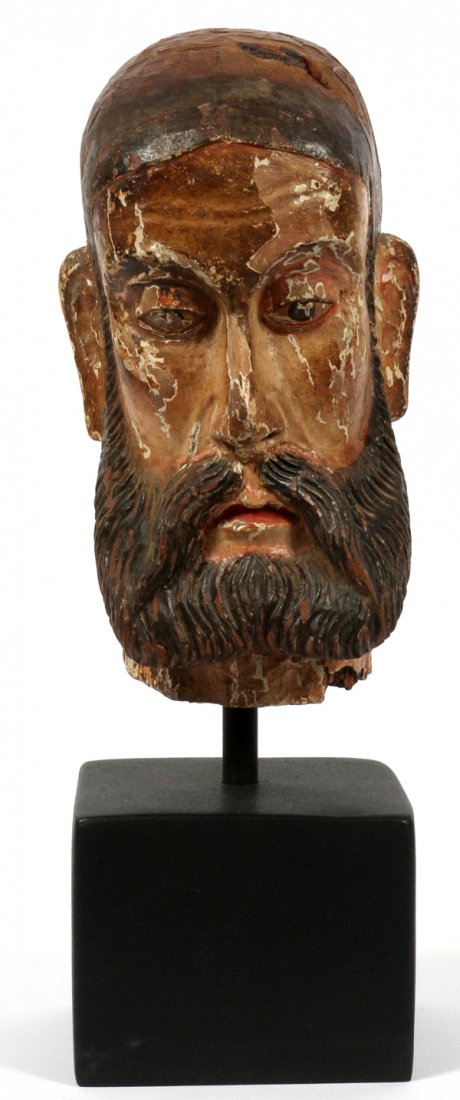 EUROPEAN ANTIQUE CARVED WOOD HEAD OF A SAINT: EUROPEAN ANTIQUE CARVED WOOD HEAD OF A SAINT, H 11 1/2", PROBABLY PORTUGUESE:Carved head of a bald man with a full beard, eyes averted down, hand painted features on a layer of white, probably gesso,