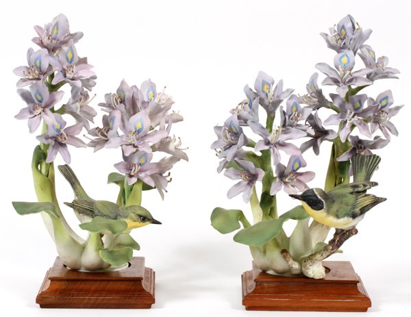 ROYAL WORCESTER BY D. DOUGHTY BISQUE PORCELAIN: ROYAL WORCESTER BY D. DOUGHTY, BISQUE PORCELAIN, FIGURINES, H 12", 'YELLOWTHROATS WITH HYACINTHS":pair of Royal Worcester bisque porcelain figurines depicting Yellowthroat Warblers perched in Water Hy