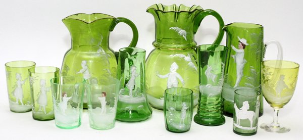 MARY GREGORY ANTIQUE CHARTREUSE GLASS PIECES: MARY GREGORY, ANTIQUE CHARTREUSE GLASS PITCHERS, VASES, AND TUMBLERS, 12 PIECES, H 3"-9 1/2":Including 4 pitchers, 1 vase, 5 tumblers, and 1 goblet, all decorated with children in white enamel; togeth