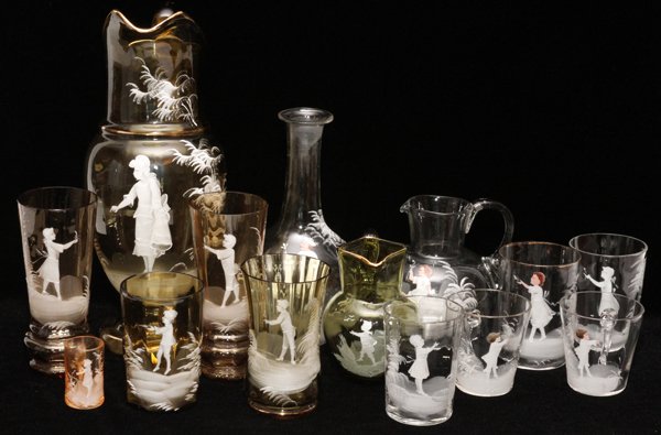MARY GREGORY ANTIQUE AMBER AND CLEAR GLASS PIECES: MARY GREGORY, ANTIQUE AMBER AND CLEAR GLASS PITCHERS, VASES, AND TUMBLERS, 14 PIECES, H 2"-12":Amber glass includes 2 pitchers, 3 vases, and 2 mugs; together with clear glass assortment including 1 de