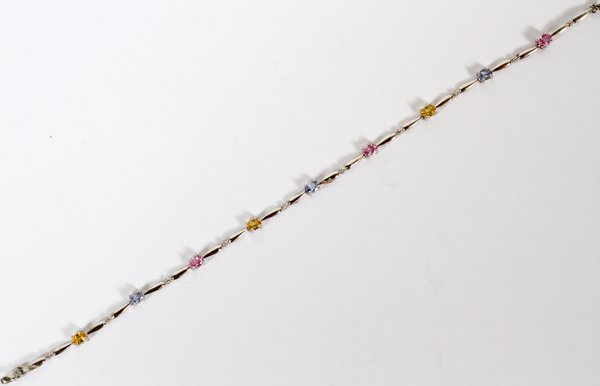 14KT LADY'S COLORED SAPPHIRE BRACELET: 14KT LADY'S COLORED SAPPHIRE BRACELET, L 7.5":Featuring nine colored sapphires (pink and yellow) set in a bracelet of 14KT white gold.