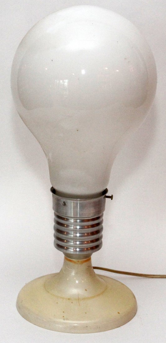 LIGHTBULB FORM LAMP: LIGHTBULB FORM LAMP, H 19 1/2":An aluminum and plastic lightbulb form lamp. Numbered 2515 at the bottom, otherwise no apparent markings.