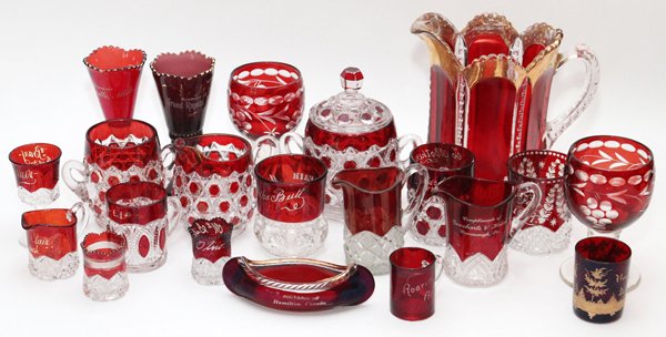 FLASHED RUBY AND AMETHYST SOUVENIR GLASS TABLEWARE: FLASHED RUBY AND AMETHYST SOUVENIR GLASS TABLEWARE, 21 PIECES, H 1 1/2"-8 1/4":Including tableware and souvenir glass; most are flashed ruby, 2 pieces are amethyst.