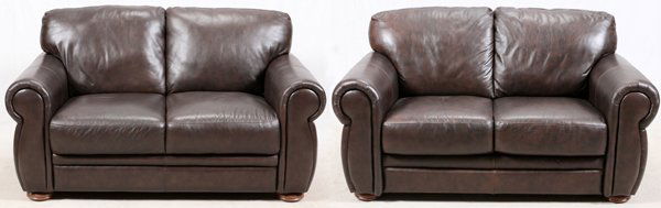 CHATEAU D'AX LEATHER SETTEES PAIR: CHATEAU D'AX LEATHER SETTEES, PAIR, H 35", W 62", D 36":Includes two loveseats upholstered in a chocolate tone leather. Contemporary.