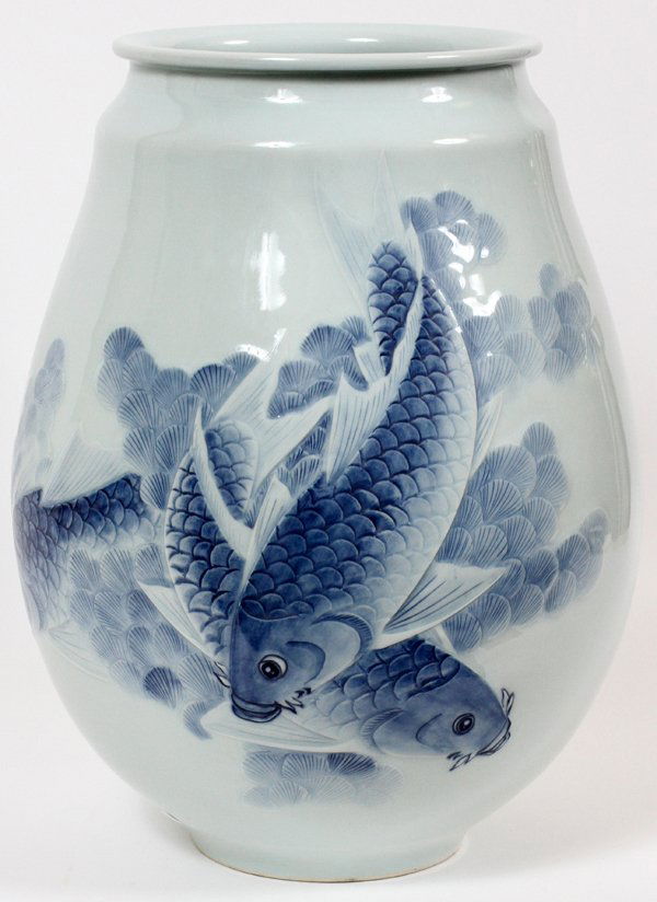 JAPANESE PORCELAIN VASE: JAPANESE PORCELAIN VASE, H 17", DIA 12":The modern Japanese vase features a white ground with a blue fish design.