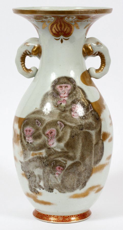 JAPANESE PORCELAIN VASE: JAPANESE PORCELAIN VASE, H 15", W 7 1/2":Hand painted with monkeys and fired gold accents, flanked by two elephant form handles. From the Estate of Daniel Clancy, Voltaire Place, Grosse Pointe Farms.