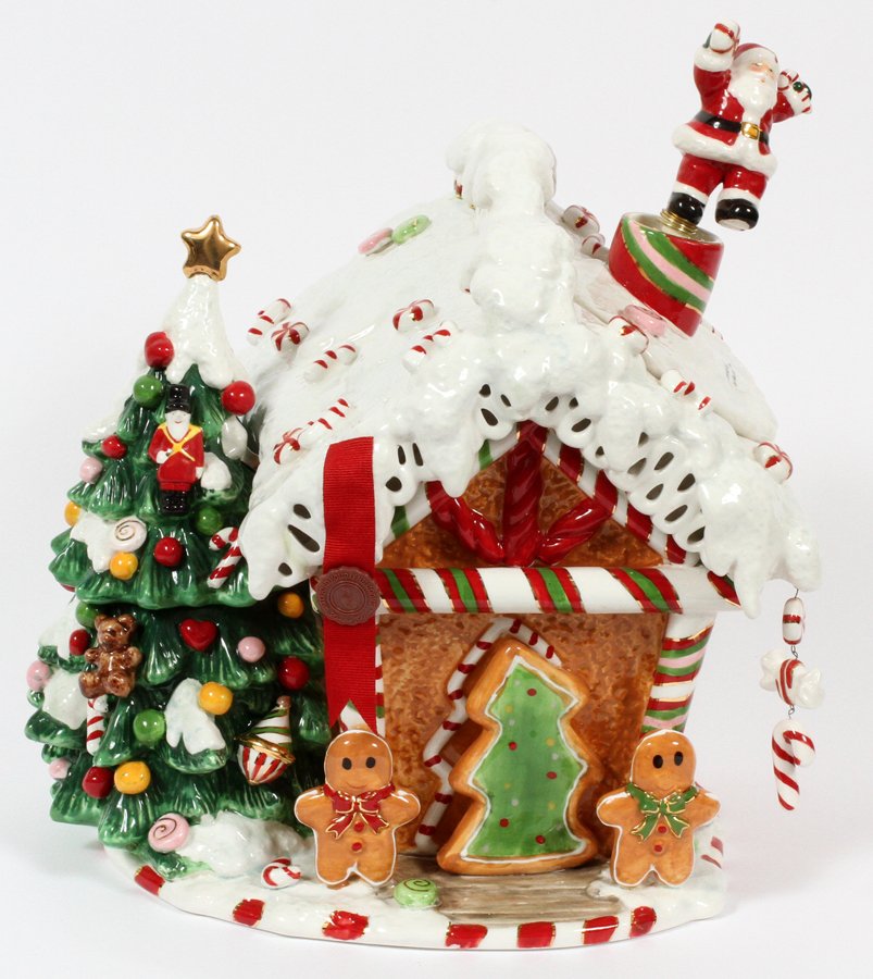 WATERFORD 'HOLIDAY HEIRLOOMS' PORCELAIN COOKIE JAR: WATERFORD, 'HOLIDAY HEIRLOOMS', PORCELAIN COOKIE JAR, H 11", W 12":A gingerbread house shaped cookie jar, limited edition, numbered at the underside 1668/5000.