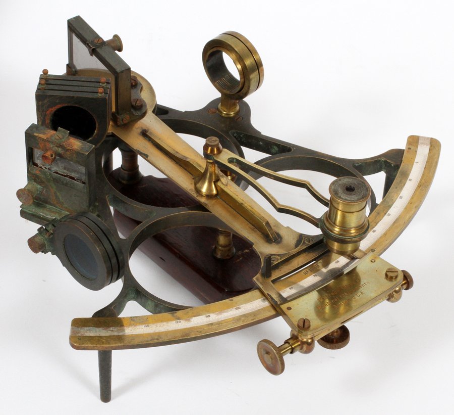 WILFRED O'WHITE SEXTANT: WILFRED O'WHITE, SEXTANT, H 5 1/4", W 11", L 10":Wilfred O'White sextant. Brass construction. Stamped: "Wilfred O'White Nautical Instruments Boston U.S.A.". With additional eyepieces. Includes a fitte