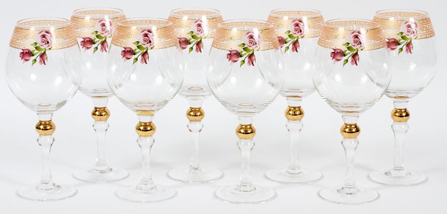GILT AND GLASS WINE GOBLETS 8 PIECES: GILT AND GLASS WINE GOBLETS, 8 PIECES, H 8 1/2":Including 8 stemmed red wine goblets; each is decorated with a gilt Greek key and rose motif about the rim. No apparent markings.