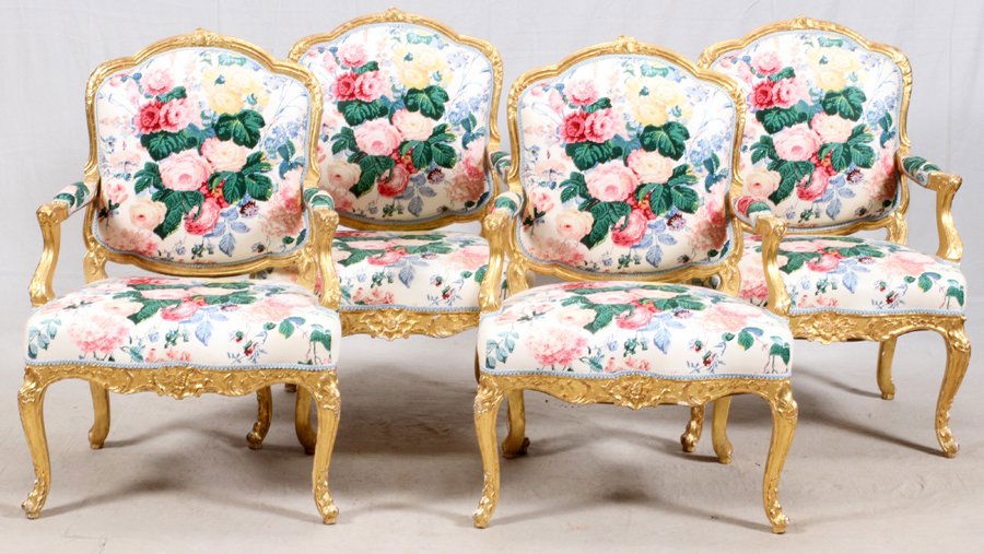 LOUIS XV STYLE CARVED GILT WOOD OPEN ARM CHAIRS: LOUIS XV STYLE CARVED GILT WOOD OPEN ARM CHAIRS SET OF FOUR:Floral upholstery From the Estate of Daniel Clancy, Voltaire Place, Grosse Pointe Farms.