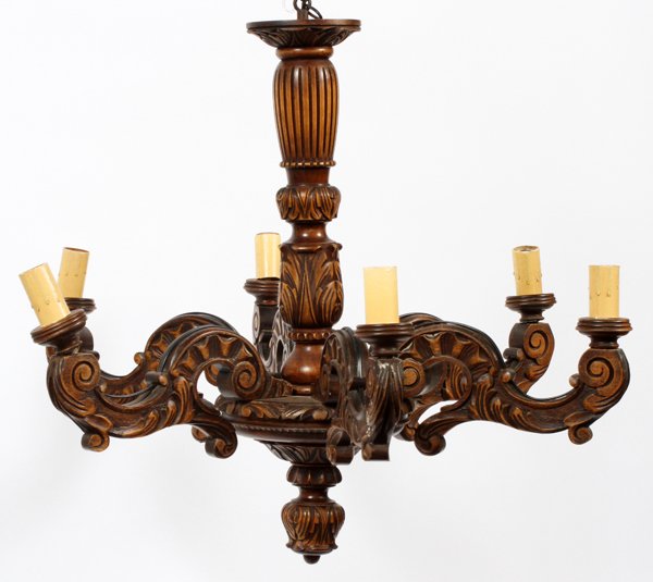 BLACK FOREST CARVED MAHOGANY 6 LIGHT CHANDELIER: BLACK FOREST, CARVED MAHOGANY, 6 LIGHT CHANDELIER, C1920, H 24", DIA 28":Having carved and turned center shaft with six carved mahogany scroll arms. Flower form finial at the bottom.