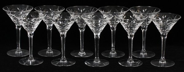 CUT CRYSTAL MARTINI GLASSES 7 PIECES: CUT CRYSTAL MARTINI GLASSES, 7 PIECES, H 6 1/4":Each with a notched stem and teardrop center. No apparent markings.