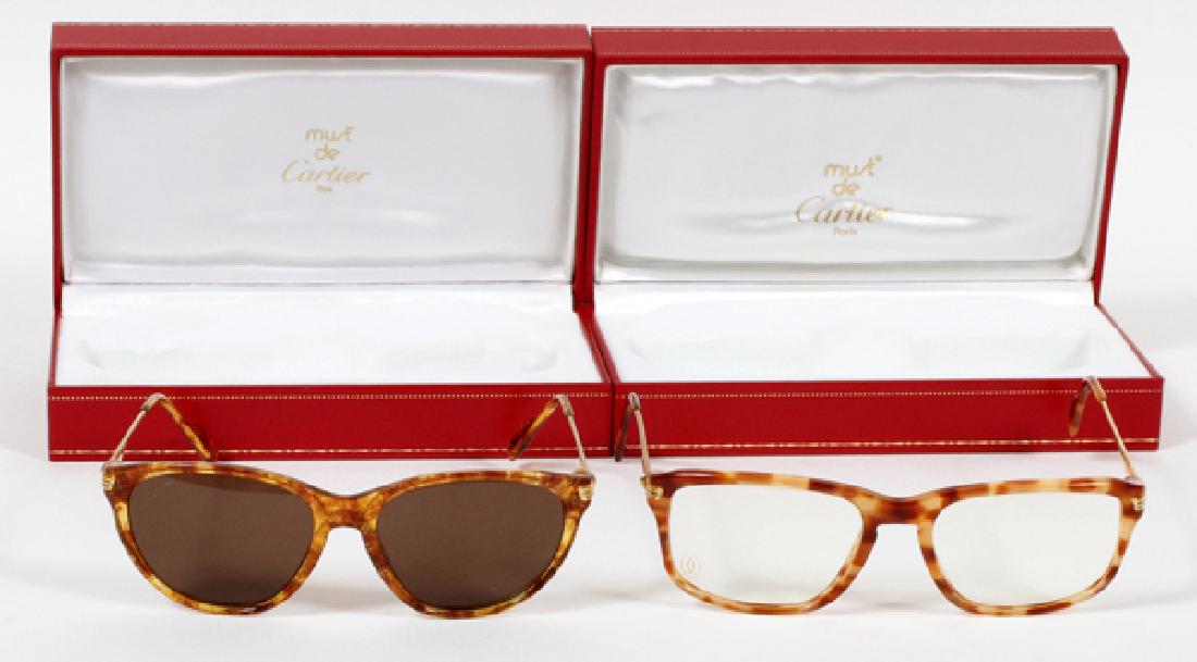 MUST DE CARTIER EYE GLASS COLLECTION: MUST DE CARTIER, EYE GLASS COLLECTION,:collection numerous styles including: 'Jaspe Brun', 'Jaspe Blond', 'Tigre Rouge' and 'Jaspe Mel Dore' to name a few. Total of 56 pairs. Most include soft red lea