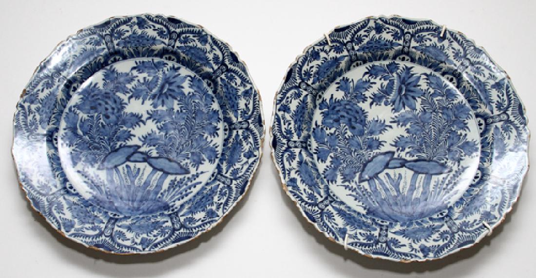 DUTCH BLUE AND WHITE PORCELAIN CHARGERS: DUTCH BLUE AND WHITE PORCELAIN CHARGERS, DIA 13 1/2":Marked at the underside. Late 18th to early 19th century. From the estate of Daniel Clancy, Voltaire Place, Grosse Pointe Farms.