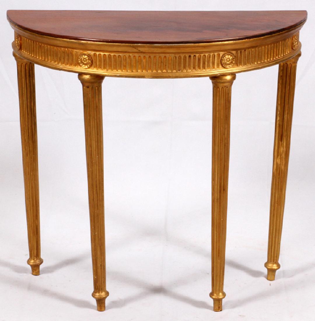 SHERATON DEMI LUNE MAHOGANY AND GILT TABLE 18TH.C.: SHERATON, DEMI LUNE MAHOGANY AND GILT TABLE, 18TH.C. H 29", W 32", D 15":Mahogany top with gilded tapered fluted legs.