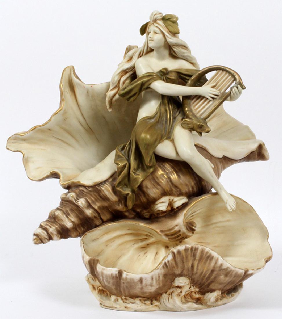 ROYAL DUX BISQUE NUDE FEMALE W/ HARP ON A SHELL: ROYAL DUX BISQUE NUDE FEMALE WITH HARP ON A SHELL, H 14", W 14", D 10":Marked on underside.