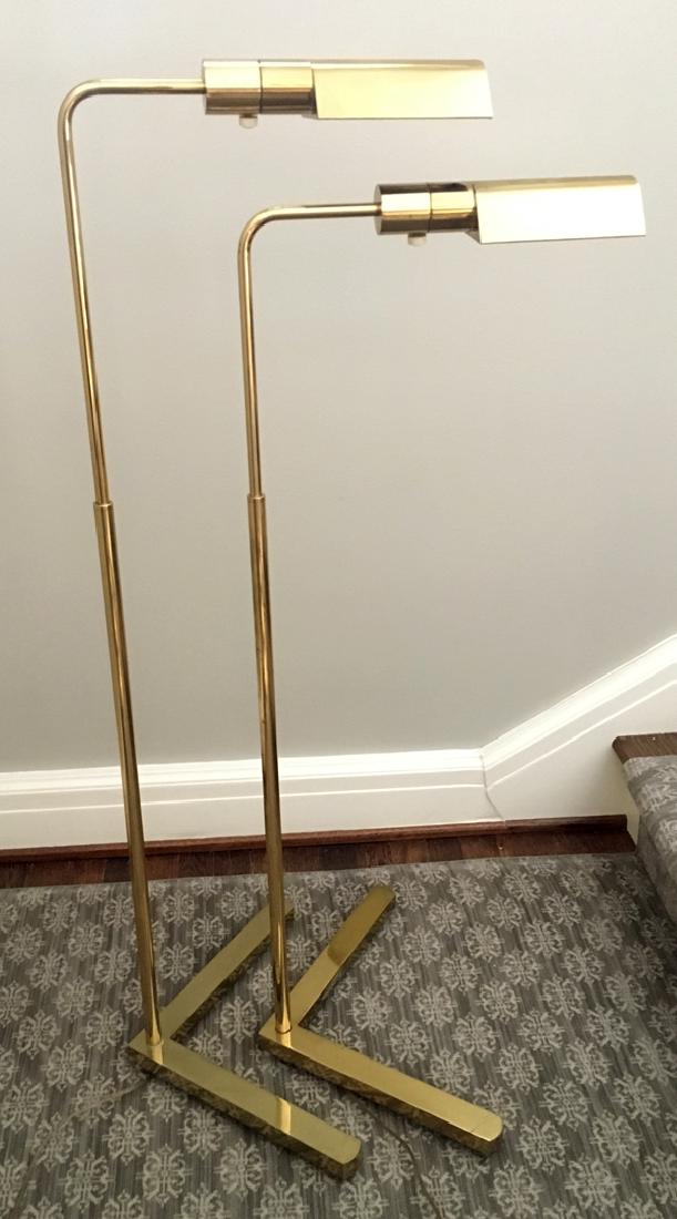 BRASS FLOOR LAMPS PAIR: BRASS FLOOR LAMPS, PAIR, H 46", W 15":A pair of adjustable brass floor lamps with 90 degree angled brass bases. Electrified. From the Estate of Daniel Clancy, Voltaire Place, Grosse Pointe Farms, MI.