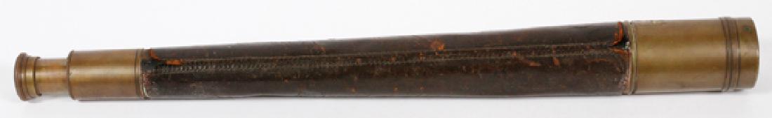 KELVIN & WILFRID O. WHITE & CO. SPYGLASS TELESCOPE: KELVIN & WILFRID O. WHITE & CO. BRASS AND LEATHER SPYGLASS TELESCOPE, L 32":Having a sliding lens cover. With maker's mark stamped to brass. Extends to 32".