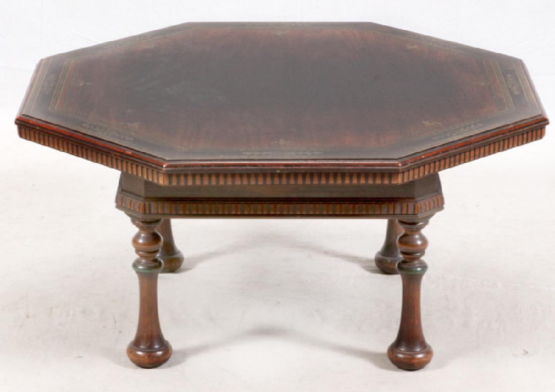 KITTINGER OCTAGONAL COFFEE TABLE: KITTINGER OCTAGONAL COFFEE TABLE, H 18, DIA 39.:Having a painted top border with vines and segmented lines, fluted edge and square frame under top turned trumpet form legs (4).