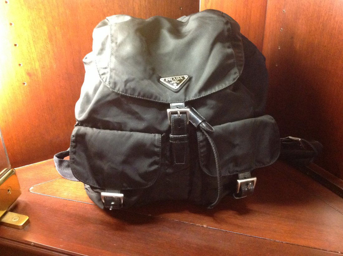 PRADA CLASSIC BLACK BACKPACK: GREAT CLASSIC BACKPACK. JUST THE RIGHT SIZE. EXCELLENT CONDITION. CELEBRITY OWNED. ORIG. PRICE $925 BIJOU LUXURY CONSIGNMENT GUARANTEES THE AUTHENTICITY OF ALL ITEMS. ABOUT US: The Partners have worke