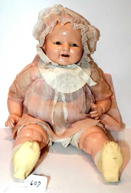 22" COMPO ALL ORIG. HORSMAN BADY DIMPLES, DRESSED IN: 22" COMPO ALL ORIG. HORSMAN BADY DIMPLES, DRESSED IN ORIG. PINK DRESS AND BONNET, WHITE MOCCASIN SHOES, UNDERWEAR, CLOTH BODY. MARKED E.I.H. CO. INC. MINOR CRAZING. FAIR TO GOOD.