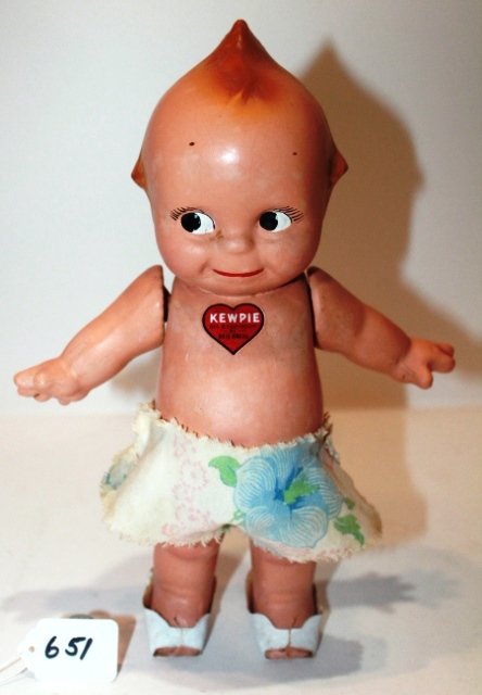 12" - COMPOSITION KEWPIE. HEART ON CHEST BY ROSE O";: 12" - COMPOSITION KEWPIE. HEART ON CHEST BY ROSE O";NEILL. FLORAL SHORTS - PAPER SLIPPERS. BLUE WINGS. GOOD CONDITION.