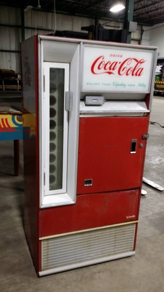 VENDO COCA COLA MACHINE: Powers up and vends glass bottles. Is missings internal shelves.