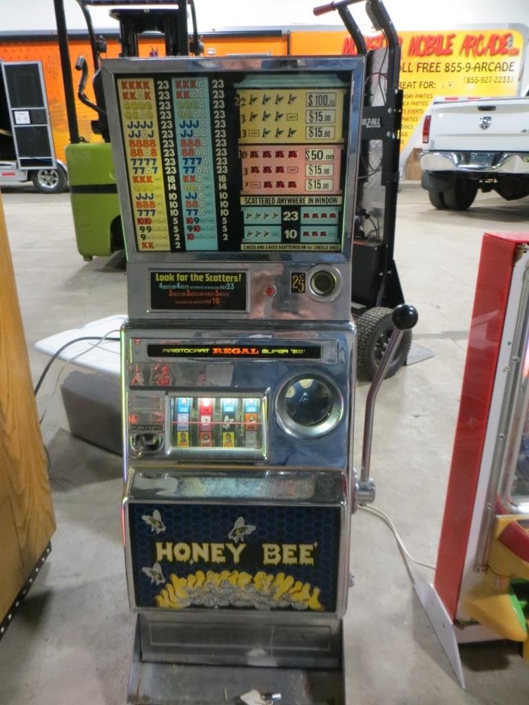 HONEY BEE SLOT MACHINE: Used item: Powers up unless otherwise noted: Old mechanical slot machine. Machine needs repair. Gears stuck.