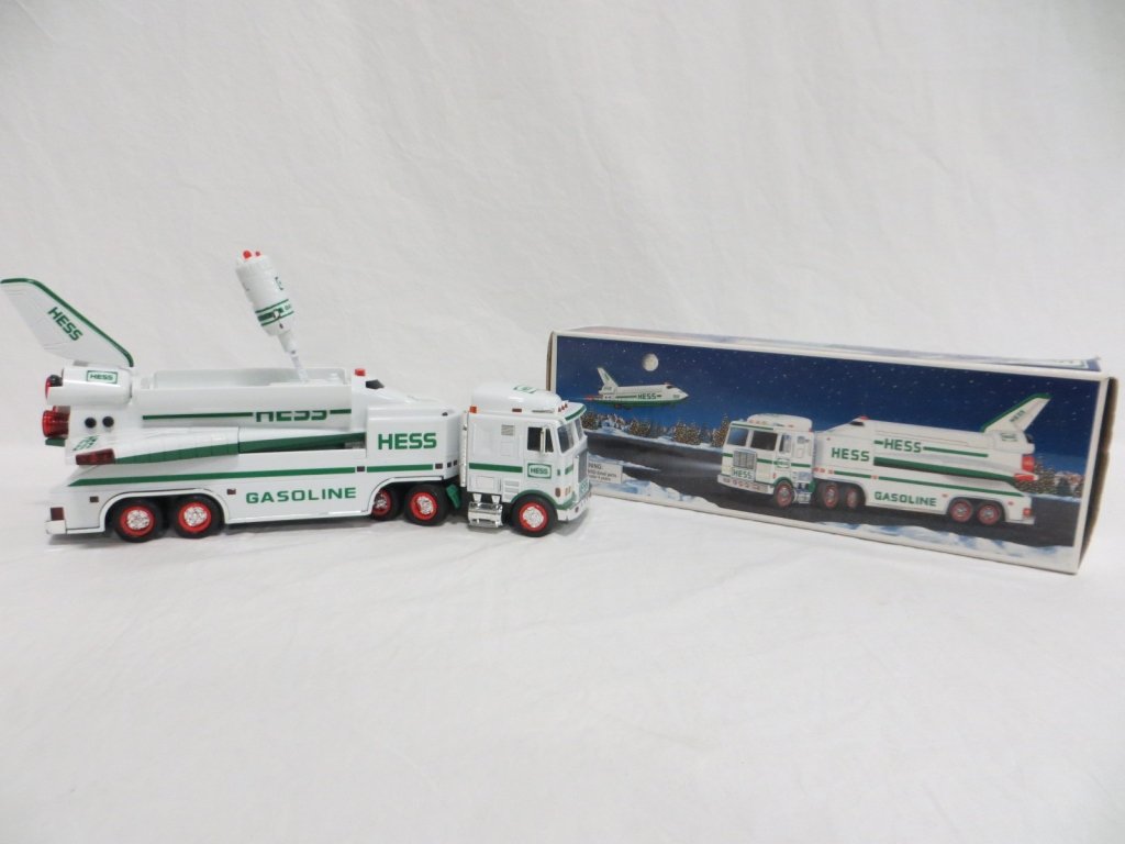 1999 HESS TOY TRUCK AND SPACE SHUTTLE W/ SATELLITE: Condition: Used. 1999 Hess Toy Truck and Space Shuttle with Satellite. Features real head and tail lights, working shuttle bay doors, shuttle lights and sound, automatic satellite launching arm and sa