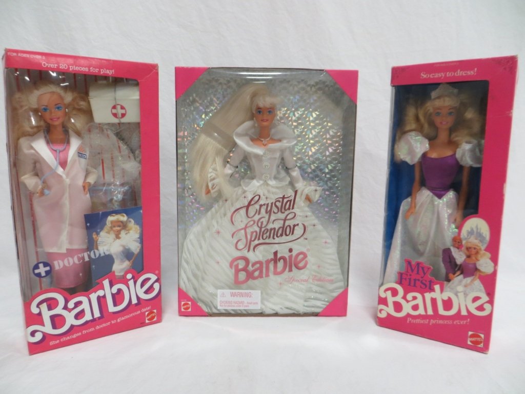 SET OF 3 - BARBIE DOLLS: Condition: New. Set of 3 Barbie dolls. Includes: My First Barbie, Doctor Barbie and Special Edition Crystal Splendor Barbie.