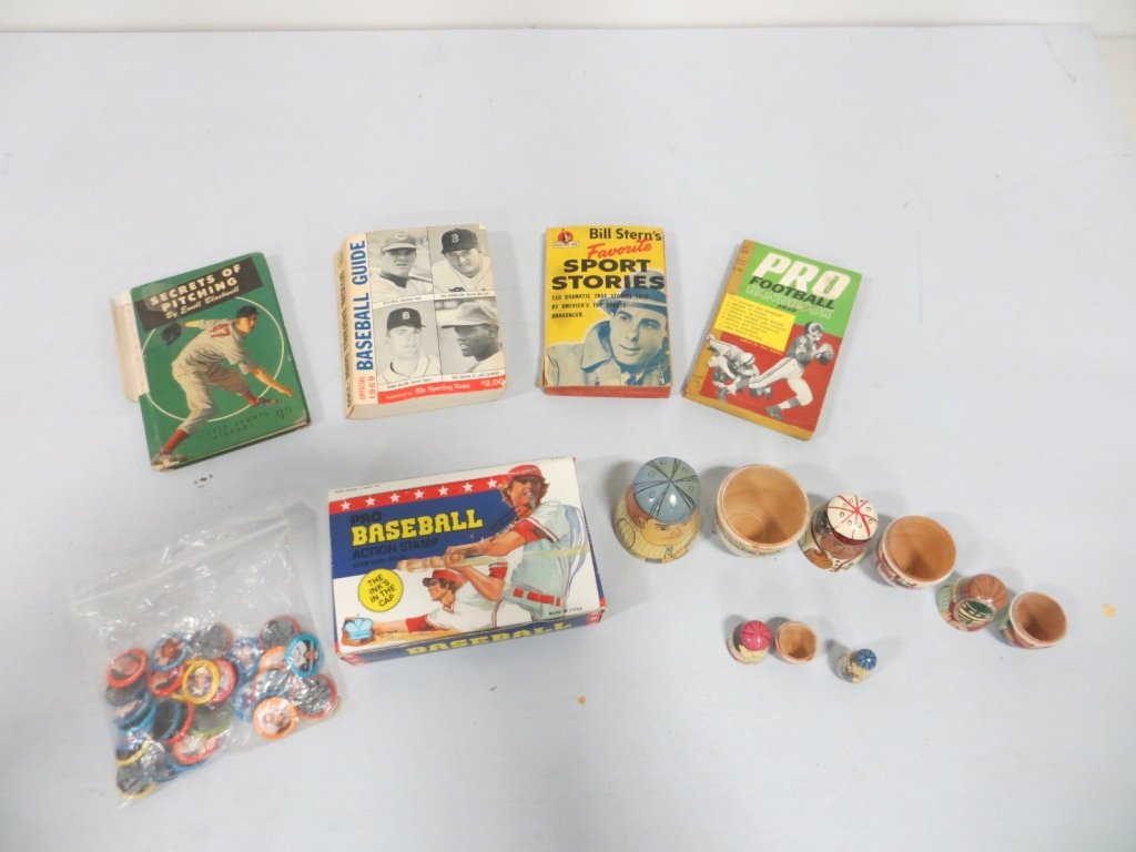 LOT OF ASSORTED BASEBALL ITEMS: Lot includes 4 books, a bag of baseball pins, a baseball action stamp set, and a nesting doll