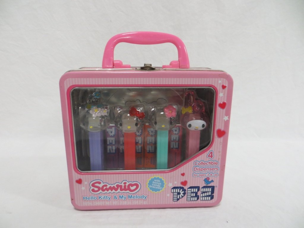 SANRIO HELLO KITTY & MY MELODY PEZ COLLECTOR'S TIN: Condition: New. Sanrio Hello Kitty & My Melody PEZ Collectibles. 3-Hello Kitty & 1-My Melody PEZ dispensers in a collectible tin lunch box.