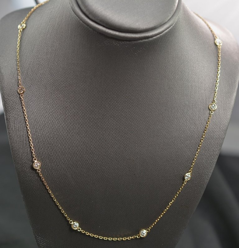 0.99 Carats t.w. Diamond by the Yard Necklace 14K Gold: Stock # : NFN00292 Item Type: Necklace Total Weight: 2.83 grams Precious Metal: 14 Karat Yellow Gold Solid Gemstone: Diamond Diamond Weight: 0.99 carat t.w. - 10 Round Diamonds Diamond Quality: (I) co
