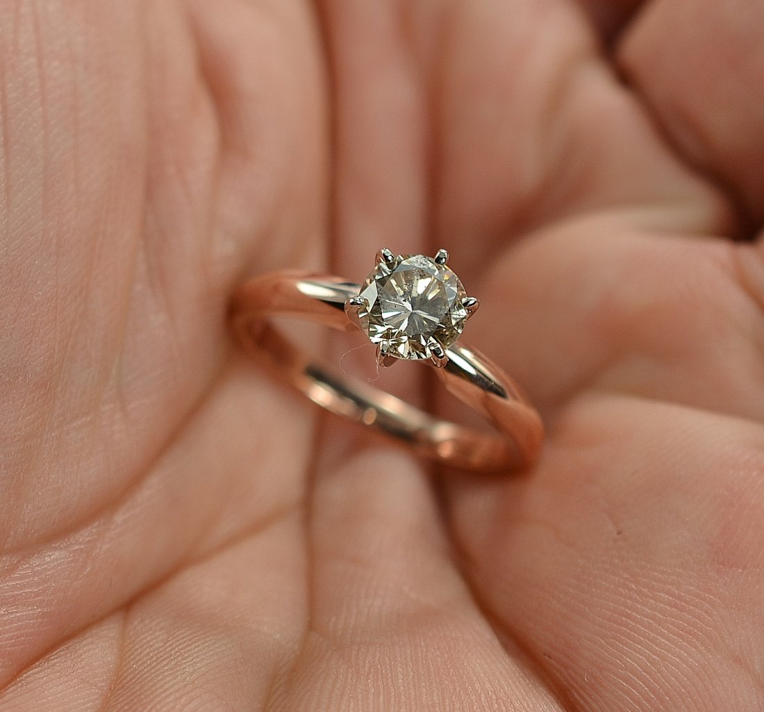 0.90 Carat Round Diamond Solitaire Wedding/Anniversary: Stock # NR05443 Estimated Retail Value: $2,399.00 Item Type: Ring Total Weight: 2.72 Grams Precious Metal: 14 Karat Rose/White Gold Solid Gemstone: Diamond Diamond Weight: 0.90 Carat - Round Brilliant