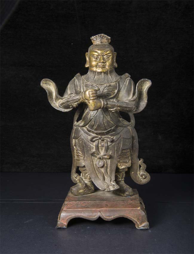 The guardian figure stands on a low plinth with his: The guardian figure stands on a low plinth with his hands held before his chest as if to hold a spear or staff. He is garbed in armor and his face sports a full beard. 38.1cm天王立&#
