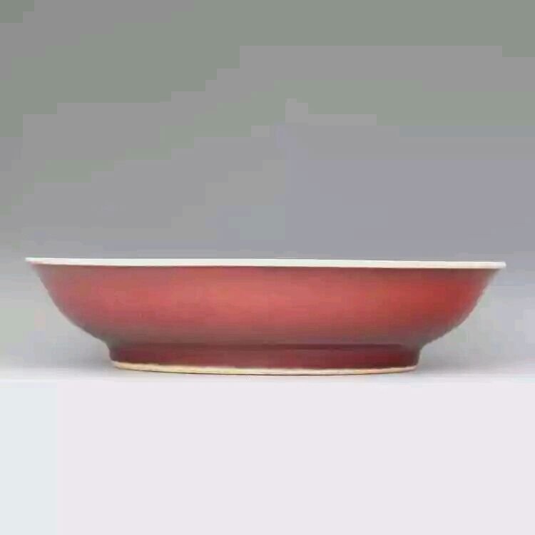 A red glazed porcelain plate (1 of 2)