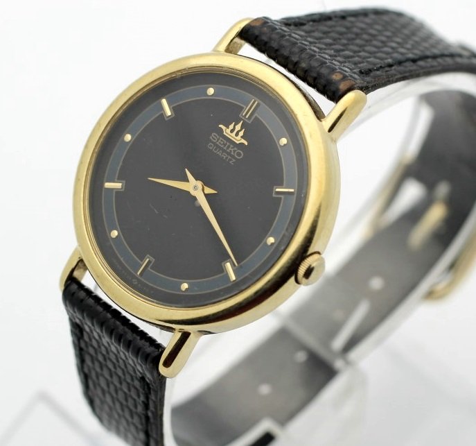 Seiko Quartz Ladies Watch Womens Clean and Running: Sleek black dial and gold tone hands. Model 5y30-600a. Adjustable band. Watches (if running) have not been timed for accuracy. No Buyers Premium