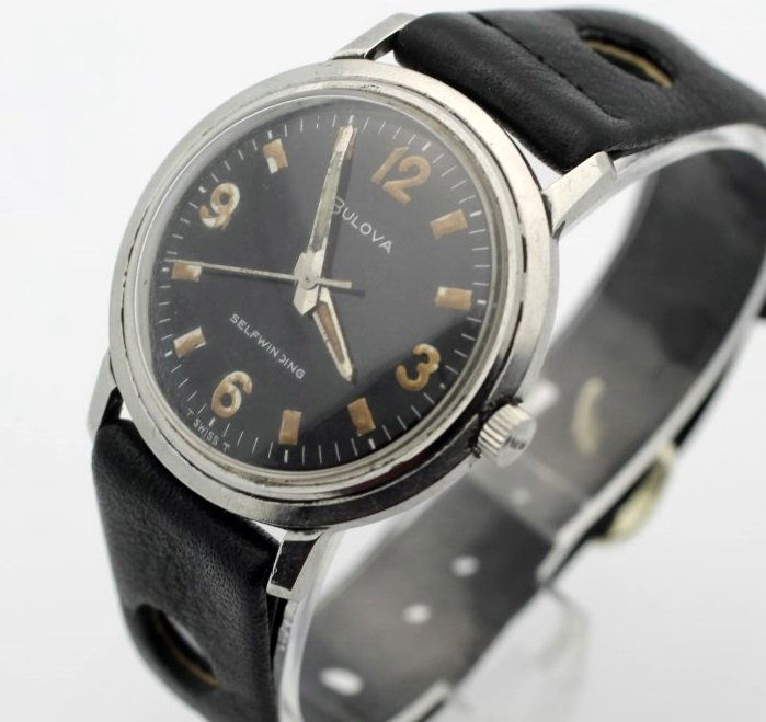 1967 Bulova Automatic Vintage Black Dial Watch: Clean and ready to wear. The watch is running. Measures 32mm across (without the crown) and 37mm top to bottom. 11ALAC movement. Watches (if running) have not been timed for accuracy. No Buyers Premiu