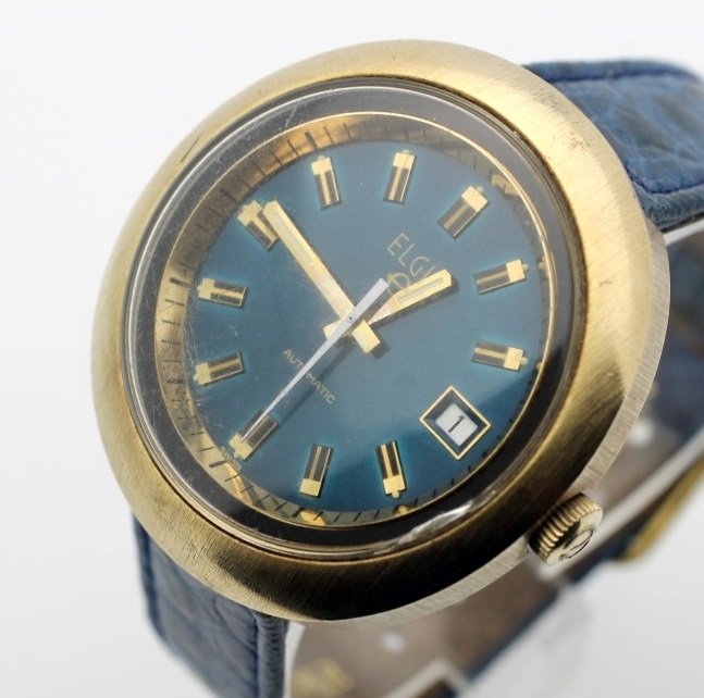 Vintage Elgin Automatic Date Dashboard Watch Cal 351: Clean dial and crystal. Very interesting looking watch and band. CAL 351 Movement. Watches (if running) have not been timed for accuracy. No Buyers Premium