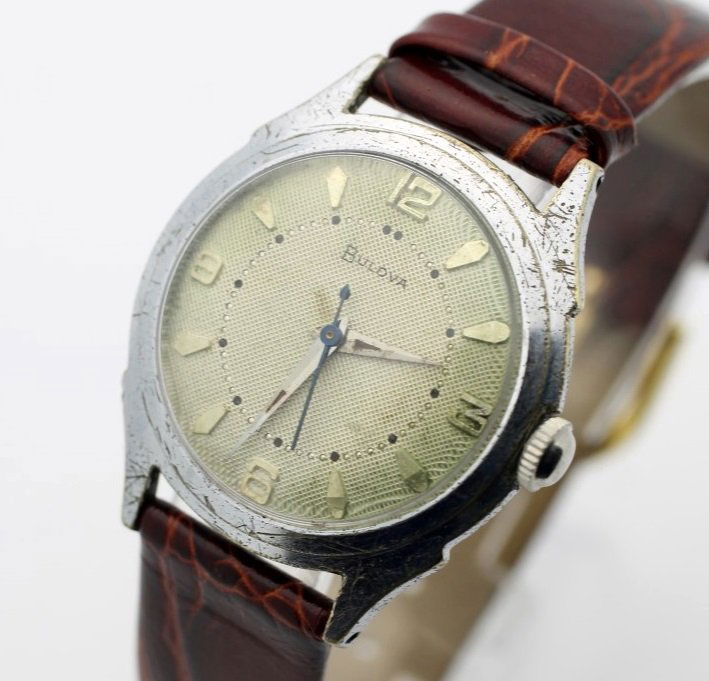 Circa 1955 BULOVA 17 Jewel Hand Wind Men's Watch: Men's Base Metal 31.5mm BULOVA With Leather Strap. Circa 1955. Cailbre 11ACC. Watch Is Currently In Working Order. No Buyers Premium.