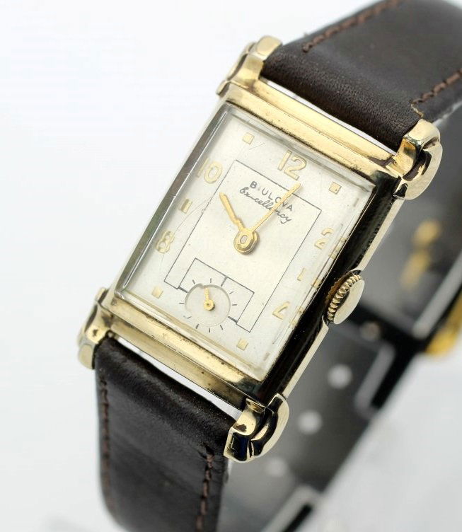 Circa 1951 BULOVA "Excellency" Hand Wind Dress Watch: Men's 10 Karat Gold Filled 23mm BULOVA With Leather Strap. Circa 1951. Calibre 7aa Hand Wind 21 Jewel Movement. Watch Is Currently In Working Order. No Buyers Premium.