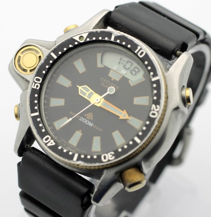CITIZEN Promaster Aqualand Quartz 200M Diver's Watch: Men's Stainless Steel 50.5mm CITIZEN With Citizen Plastic Strap. Digital Part Of Watch Is Working. Analog Parts Are Not Running. No Buyers Premium.